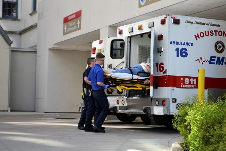 ambulance at hospital unloading an injured person